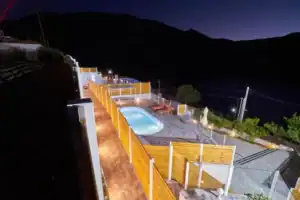 Lake View Suites Luxury Villa - evening aerial view of private pools and lake