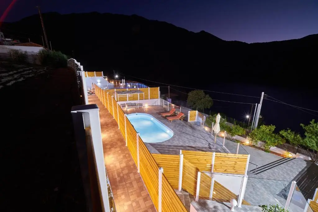 Lake View Suites Luxury Villa - evening aerial view of private pools and lake