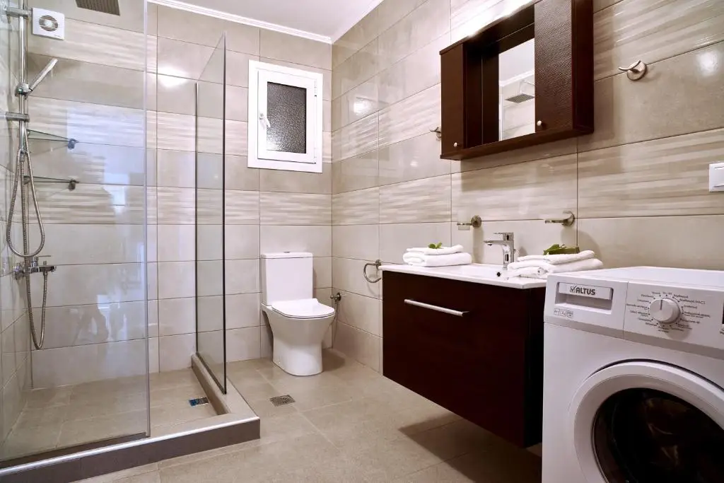 Lake View Luxury Suite 1 - modern bathroom with shower and washing machine