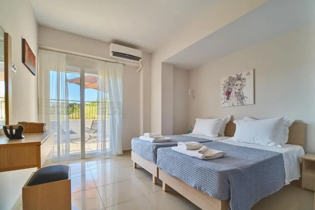 Lake View Suites Luxury Villa - comfortable twin bedroom with balcony access