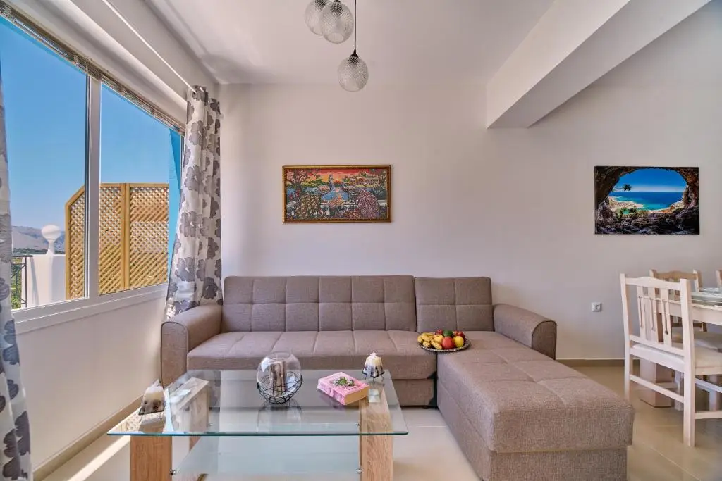 Lake View Luxury Suite 1 - spacious living room with sofa and city view